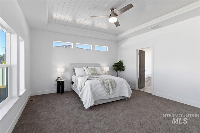 2895 Evening Sun Dr, Twin Falls, ID 83301 - bedroom with a tray ceiling, carpet floors, connected bathroom, ceiling fan, and crown molding
