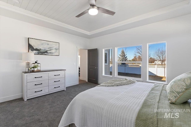 2895 Evening Sun Dr, Twin Falls, ID 83301 - bedroom featuring dark carpet, baseboards, a raised ceiling, and a ceiling fan