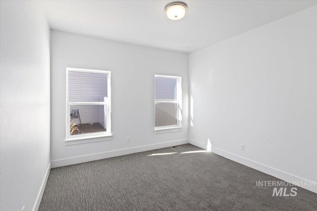 2895 Evening Sun Dr, Twin Falls, ID 83301 - unfurnished room featuring dark carpet and baseboards