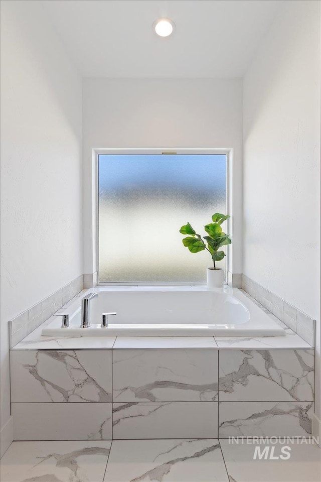 2895 Evening Sun Dr, Twin Falls, ID 83301 - bathroom with marble finish floors, healthy amount of natural light, a bath, and recessed lighting