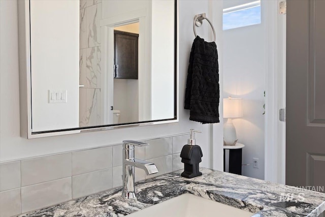 2895 Evening Sun Dr, Twin Falls, ID 83301 - bathroom with tasteful backsplash and vanity