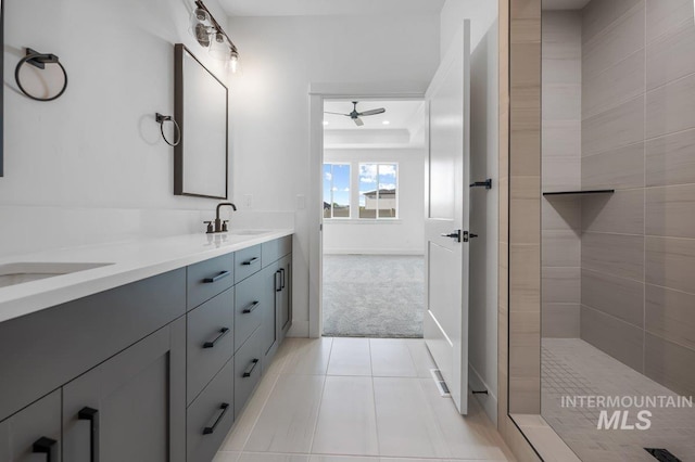 bathroom featuring dual bowl vanity, tile flooring, and ceiling fan