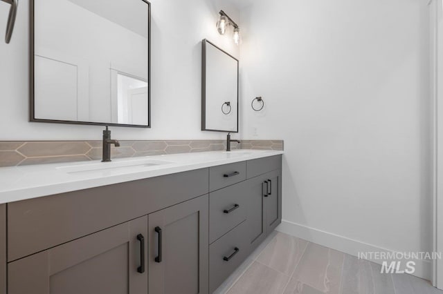 bathroom with tile floors and double sink vanity