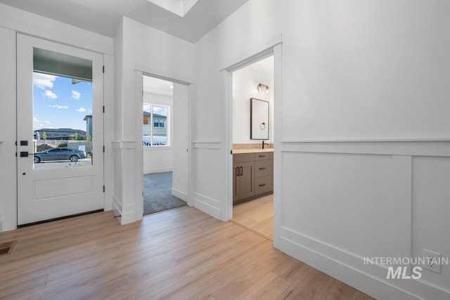 foyer with light wood-type flooring