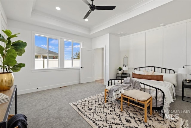 bedroom featuring baseboards, carpet, visible vents, recessed lighting, and a raised ceiling