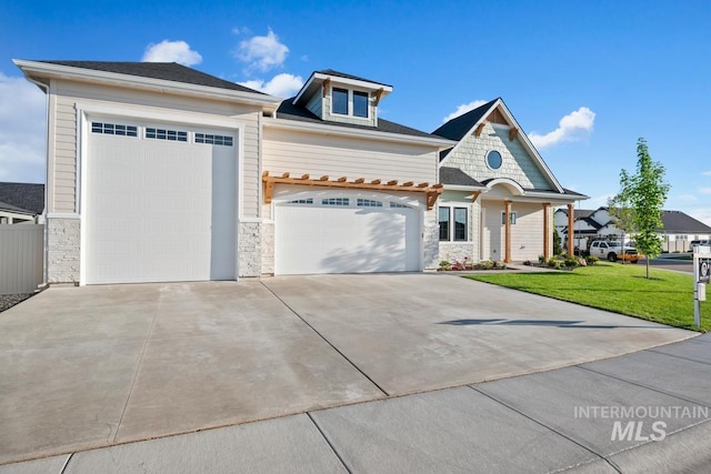 421 W Kinross St, Middleton, ID 83644 - view of front of property with stone siding, an attached garage, driveway, and a front lawn