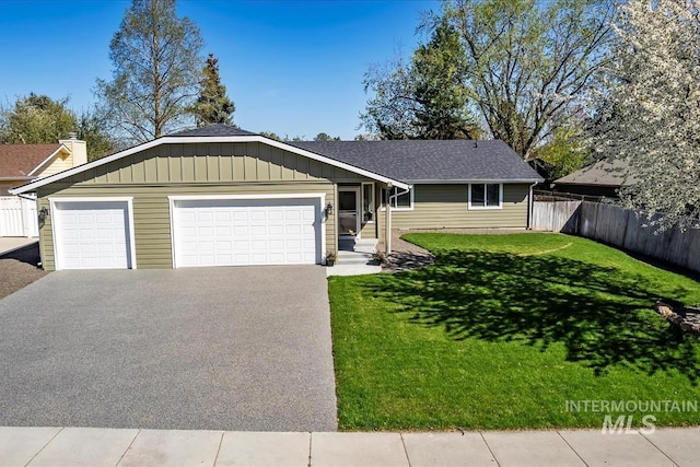 659 N Palmetto Dr, Eagle, ID 83616 - single story home featuring a front lawn, fence, an attached garage, board and batten siding, and aphalt driveway