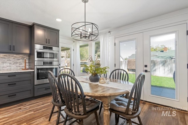 659 N Palmetto Dr, Eagle, ID 83616 - dining space featuring wood finished floors, a chandelier, and recessed lighting