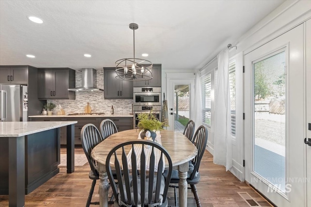 659 N Palmetto Dr, Eagle, ID 83616 - dining space with visible vents, a wealth of natural light, recessed lighting, and dark wood finished floors