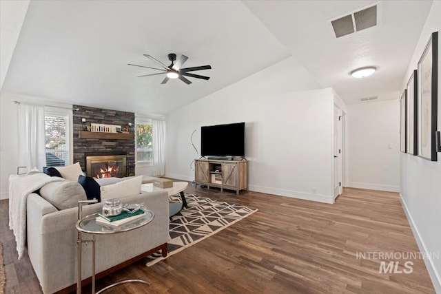 659 N Palmetto Dr, Eagle, ID 83616 - living room with wood finished floors, visible vents, baseboards, a fireplace, and ceiling fan