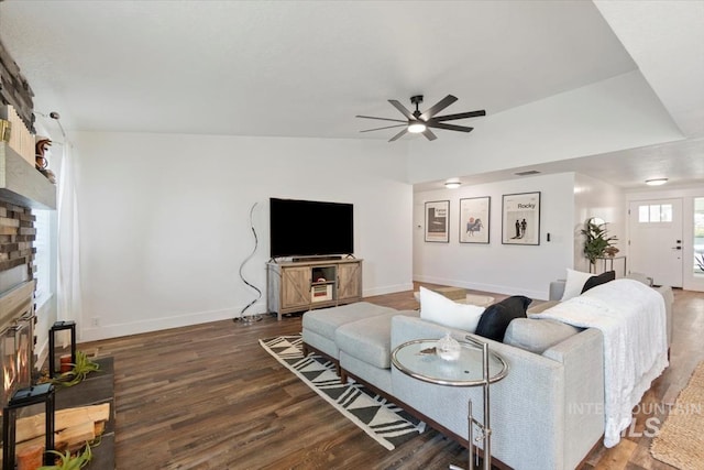 659 N Palmetto Dr, Eagle, ID 83616 - living room with ceiling fan, baseboards, a glass covered fireplace, and wood finished floors