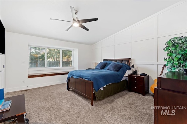 659 N Palmetto Dr, Eagle, ID 83616 - bedroom featuring vaulted ceiling, a decorative wall, a ceiling fan, and light colored carpet