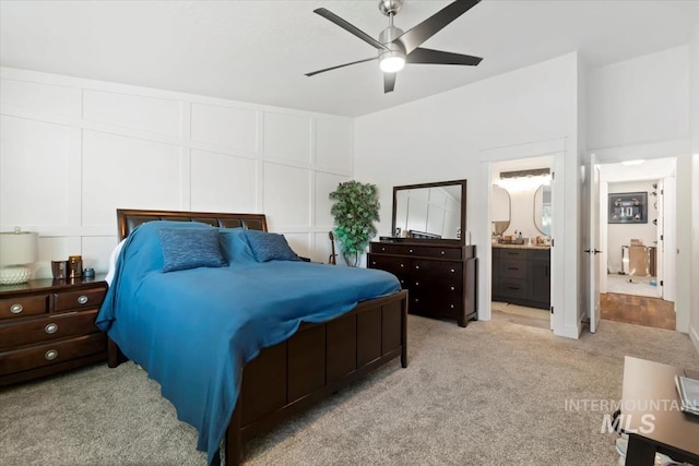 659 N Palmetto Dr, Eagle, ID 83616 - bedroom with light colored carpet, ensuite bath, a ceiling fan, and a decorative wall