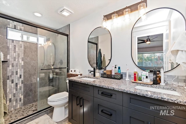 659 N Palmetto Dr, Eagle, ID 83616 - full bathroom featuring toilet, a ceiling fan, a sink, and a stall shower