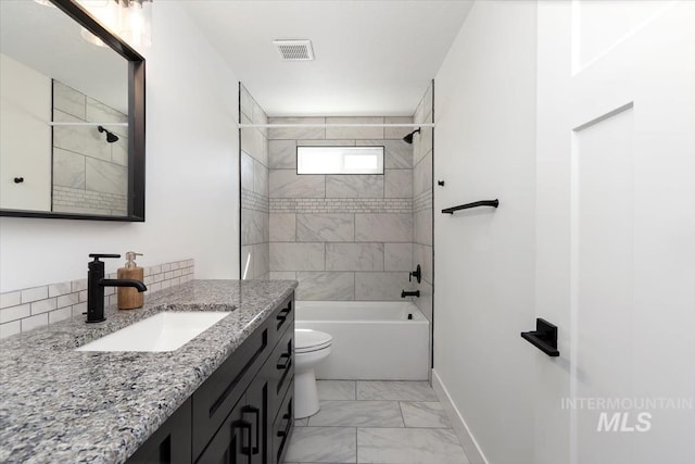 659 N Palmetto Dr, Eagle, ID 83616 - bathroom with vanity, marble finish floor, baseboards, toilet, and bathing tub / shower combination