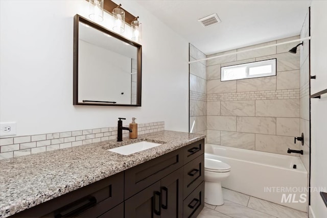659 N Palmetto Dr, Eagle, ID 83616 - full bath with vanity, washtub / shower combination, marble finish floor, toilet, and visible vents