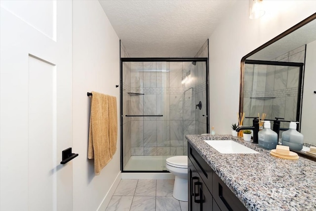 659 N Palmetto Dr, Eagle, ID 83616 - bathroom featuring a textured ceiling, toilet, marble finish floor, a shower stall, and vanity