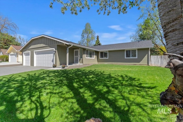 659 N Palmetto Dr, Eagle, ID 83616 - ranch-style home with fence, a front lawn, board and batten siding, driveway, and a garage