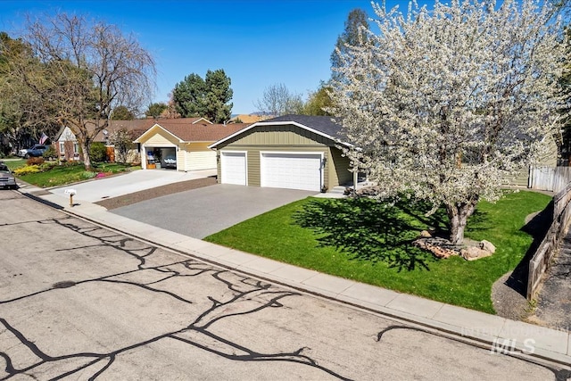 659 N Palmetto Dr, Eagle, ID 83616 - ranch-style home featuring driveway, fence, an attached garage, board and batten siding, and a front yard