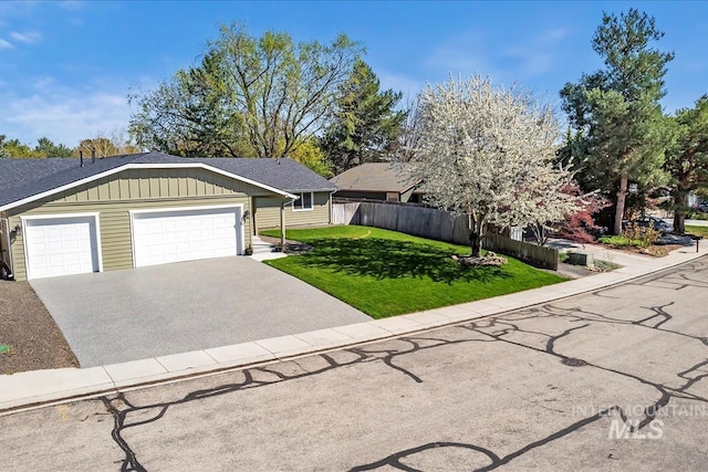 659 N Palmetto Dr, Eagle, ID 83616 - single story home featuring aphalt driveway, fence, a front lawn, board and batten siding, and a garage