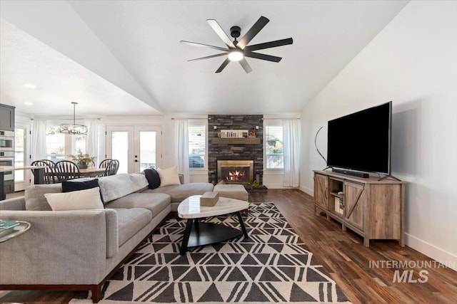 659 N Palmetto Dr, Eagle, ID 83616 - living room with lofted ceiling, a ceiling fan, a large fireplace, and dark wood-type flooring