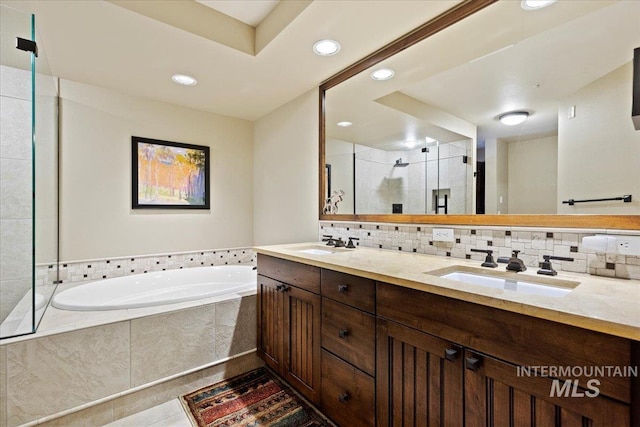 bathroom with vanity, tile patterned floors, and independent shower and bath