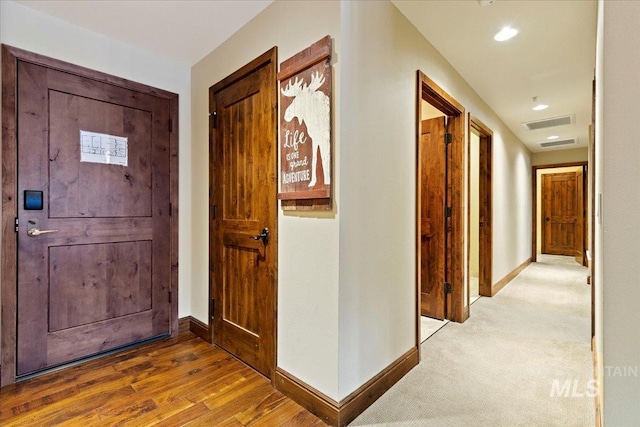 hall with wood-type flooring