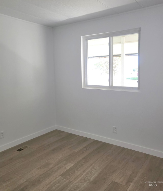 116 E 2nd St, Middleton, ID 83644 - spare room featuring wood finished floors and baseboards