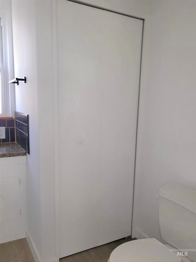 116 E 2nd St, Middleton, ID 83644 - bathroom featuring toilet, vanity, and wood finished floors