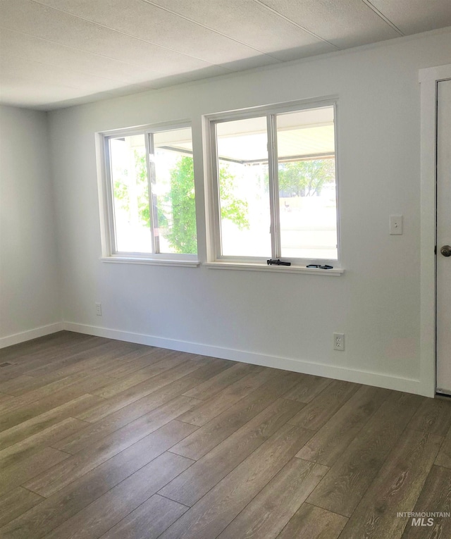 116 E 2nd St, Middleton, ID 83644 - empty room featuring dark wood-style flooring and baseboards