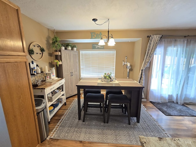 1451 Spurlock Ct, Twin Falls, ID 83301 - dining space with wood finished floors and a chandelier