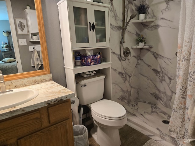 1451 Spurlock Ct, Twin Falls, ID 83301 - bathroom with a marble finish shower, vanity, and wood finished floors