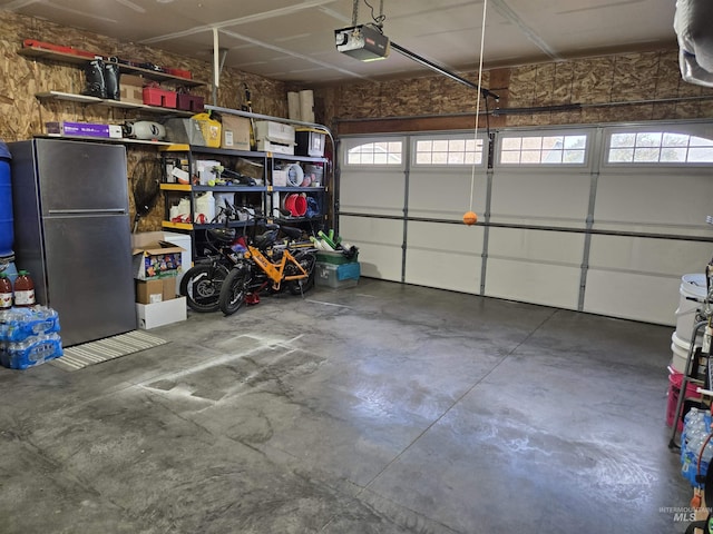 1451 Spurlock Ct, Twin Falls, ID 83301 - garage with freestanding refrigerator and a garage door opener