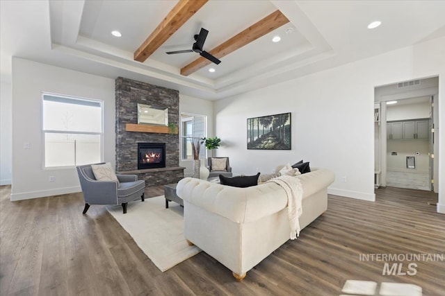 8820 E Snow Drop St, Nampa, ID 83687 - living area featuring baseboards, ceiling fan, dark wood-style flooring, and visible vents