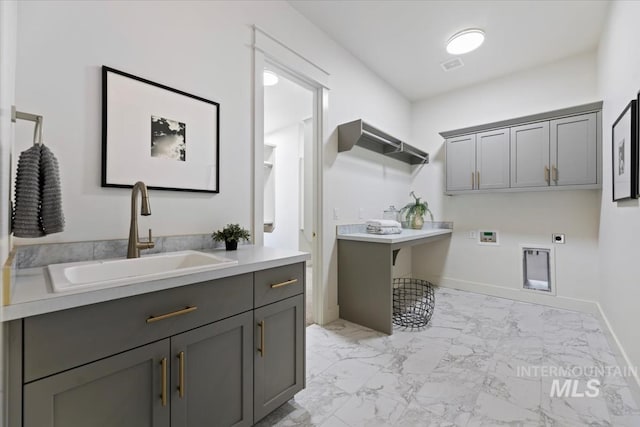 8820 E Snow Drop St, Nampa, ID 83687 - washroom with cabinet space, a sink, marble finish floor, electric dryer hookup, and visible vents