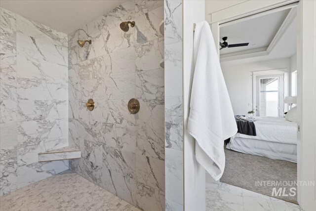 8820 E Snow Drop St, Nampa, ID 83687 - bathroom featuring a tile shower, marble finish floor, and connected bathroom