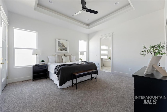 8820 E Snow Drop St, Nampa, ID 83687 - bedroom featuring crown molding, a raised ceiling, baseboards, carpet flooring, and ensuite bath