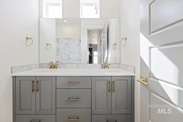 8820 E Snow Drop St, Nampa, ID 83687 - bathroom featuring double vanity and a sink
