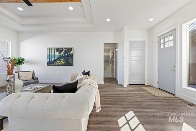 8820 E Snow Drop St, Nampa, ID 83687 - living room with baseboards, recessed lighting, wood finished floors, and a raised ceiling