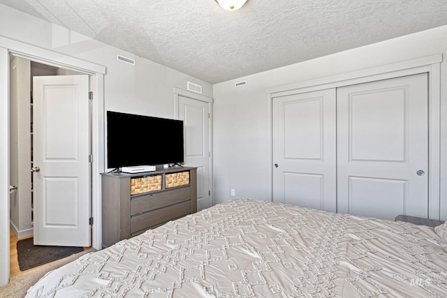 2312 E Spice Loop Unit 2, Nampa, ID 83687 - bedroom featuring a closet and a textured ceiling