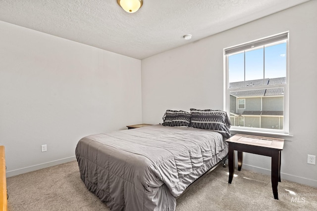 2312 E Spice Loop Unit 2, Nampa, ID 83687 - carpeted bedroom featuring baseboards and a textured ceiling