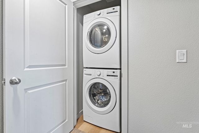 2312 E Spice Loop Unit 2, Nampa, ID 83687 - washroom featuring stacked washer / dryer and light wood finished floors