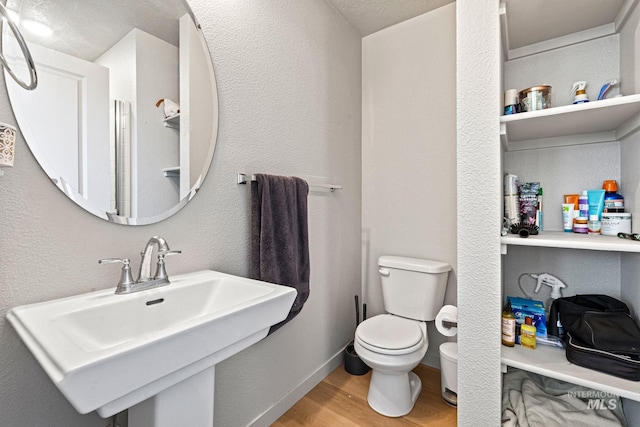 2312 E Spice Loop Unit 2, Nampa, ID 83687 - half bathroom with a sink and wood finished floors
