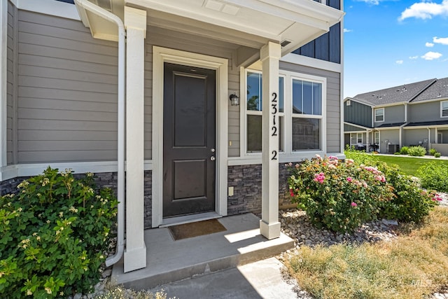 2312 E Spice Loop Unit 2, Nampa, ID 83687 - view of exterior entry with stone siding and board and batten siding