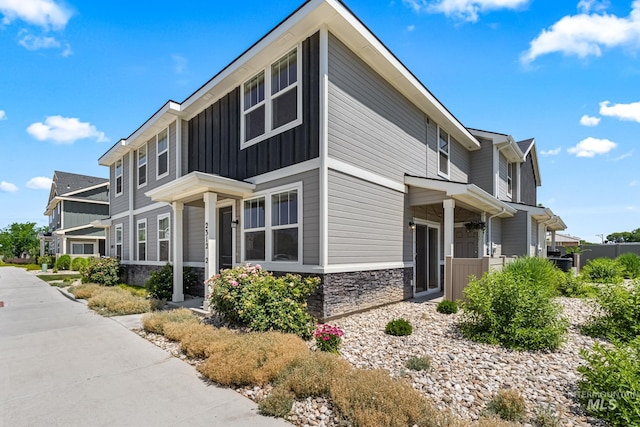 2312 E Spice Loop Unit 2, Nampa, ID 83687 - view of home's exterior with stone siding and board and batten siding