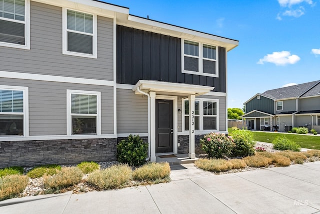 2312 E Spice Loop Unit 2, Nampa, ID 83687 - view of front of home featuring board and batten siding and stone siding