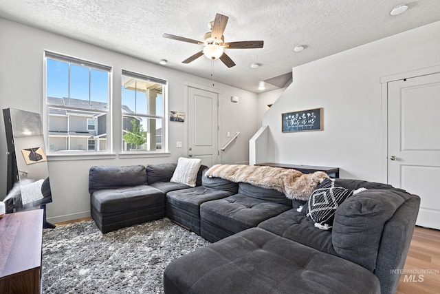2312 E Spice Loop Unit 2, Nampa, ID 83687 - living area featuring wood finished floors, a textured ceiling, and a ceiling fan