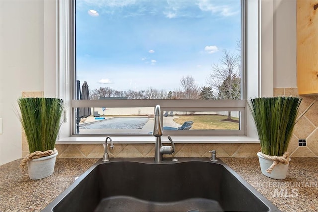 interior details featuring a sink