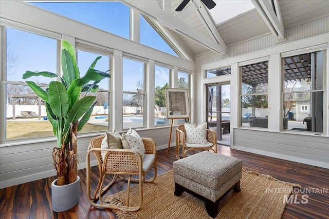 sunroom with vaulted ceiling with beams and ceiling fan