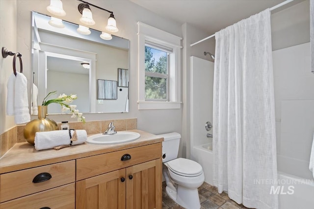 bathroom featuring shower / tub combo, vanity, and toilet